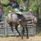 Jeremy Dillon, of Milton, rides towards a tied second place in the Lawrence Rodeo saddle bronc...