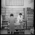 A decimal currency conversion chart in a Dulux paint shop. Photo: Evening Star collection