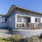 The 1960s house on Lakeview Terrace, Lake Hāwea, sold for $2.665m – a handsome gain of $2.455m in...