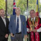 Kevin Cole, flanked by city councillor Yani Johanson and Mayor Phil Mauger, received his civic...