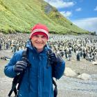 Michael Snedic flanked by king penguins on Macquarie Island. PHOTO: SUPPLIED