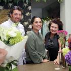 The Florist owners Jared and Meriana Ovens (centre), and florist Julie-Anne Smith, opened their...