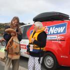 Old4New Lifejacket Upgrade Campaign worker Isabelle Cushman shows a returned lifejacket to Bev...