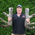 Brock Deer owner Elliot Brock displays the velvet head of 752BL20, a stag which sold for $100,000...