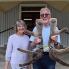 Netherdale Red Deer Stud owners David and Lynley Stevens display the velvety head of 3-year-old...