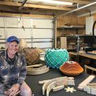 Light designer Tony Burrows in his Wānaka workshop. PHOTO: MARJORIE COOK 