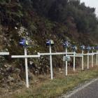 White crosses line the road to the Pike River Mine in tribute to the 29 workers who died when the...