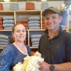 Esta and Tim Naylor hold their Romney lamb’s wool, which has been used to create the jerseys in...