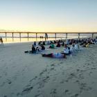 About 100 people turned out for a sunrise yoga session at New Brighton beach from 6.30am on...