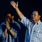 Prabowo Subianto gestures to his supporters as he claims victory in the general election during...