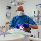 John Molloy attends to his last patient. PHOTO: RHYVA VAN ONSELEN