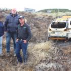 Oki St, Oreti Beach residents (from left) Joyce Kolk, Gavin Booth and Johan Groters stand next to...