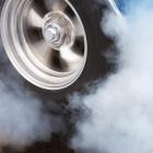 A car doing a burnout so that the tires spin smoke and smell of rubber. Photo: Getty Images