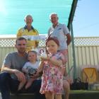 Isabel Gillaly, 2, examines a bowls jack at the Alexandra District Club Bowls green. Watching on...