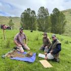 Quorum Sense project leader Sam Lang (left) assesses the soil in a trial paddock with Michael...