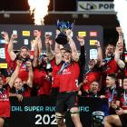 The Crusaders celebrate with the Super Rugby trophy. Photo: Getty Images