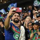Warriors half Shaun Johnson poses for selfies with fans after the NRL preliminary final match...