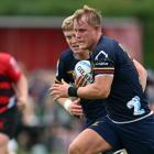 The Highlanders' Sam Gilbert heads towards the tryline during their win over the Crusaders in...