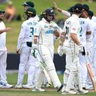 New Zealand's Tom Latham walks off after being dismissed by South Africa's Dane Piedt. Photo:...