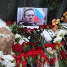 A photo of Alexei Navalny lies among flowers near the Wall of Grief monument, February 17, 2024,...