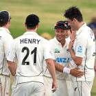 Black Caps players celebrate with Will O'Rourke (R) after his dismissal of South Africa's Dane...
