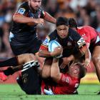 Josh Ioane of the Chiefs is tackled during the round one Super Rugby Pacific match between the...