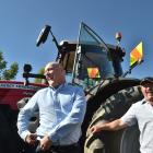 Prime Minister Christopher Luxon (left) has a laugh with Dillon Harvesting owner Mark Dillon, of...