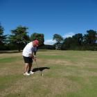 Sergeant Tony Woodbridge, of Oamaru, takes careful aim during his third round of golf for a good...