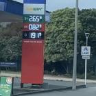 A sign at the Waitomo Northgate fuel station, in Cumberland St, displays heavily discounted 95...