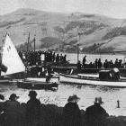 Spectators watch the action at the Ravensbourne regatta, on Otago Harbour. — Otago Witness, 4.3.1924