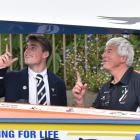 Coastal rower Ian Hamilton shows Otago Boys’ High School rower Archie Chittock, 17, his boat...