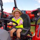 Addison Wadsworth, 2, of Otapiri Gorge, tries out a Massey Ferguson tractor at the Southern Field...