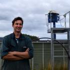Dairy farmer Michael Souness and the Kliptank effluent tank on Inch Clutha. PHOTO: SHAWN MCAVINUE