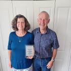 Southland oat growers Graeme and Elspeth Gardyne display a plaque from Plant Research Ltd...