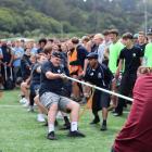 Students from Knox College compete against Selwyn College during the popular tug-of-war...