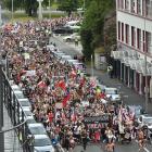 Some of the 1500 protesters march toward the Octagon.