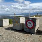 Road blocks were set up on Friday at Bluecliffs, Te Waewae Bay, Southland. PHOTO: TONI MCDONALD