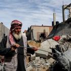 A Palestinian stands at the site of an Israeli strike on a house in Rafah in the southern Gaza...
