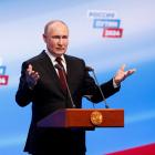 Vladimir Putin speaks at his election campaign headquarters after polling stations closed on the...