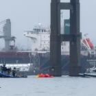 Emergency dive teams work at the scene of the collapsed bridge in Baltimore Harbor. Photo: Reuters