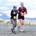 Cathy Bailey (left) and Jessica Kats participate in the Race the Summit 11km event at Mt Cargill...