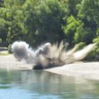 Two explosives found on the riverbank near Clyde were detonated by the New Zealand Defence Force...