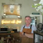 Baz Farrell stands behind the counter of the Courthouse Cafe in Alexandra. He and his wife, Becs,...