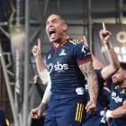 An ecstatic Aaron Smith celebrates a win in his final home game for the Highlanders at Forsyth...