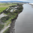 An aerial view of Bluecliffs, perched next to the Waiau River and ocean. The small Southland...