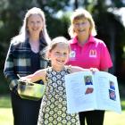 Macandrew Bay School year 4 pupil Anne Bertoli, 8, holds a cookbook she and her peers made to...
