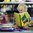 Keen reader Jamie Wigley gets stuck into the stacks of books his mum is helping collect and buy...