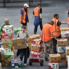 Volunteers sort boxes of books for the annual Regent Theatre 24 hour Book sale at the Edgar...