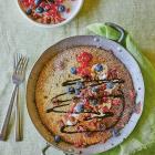 Seeded baked pancake with berries and cocoa sauce.
