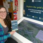 Tuapeka Goldfields Museum &amp; Visitor Centre manager Jess Weichler demonstrates Lawrence’s new...